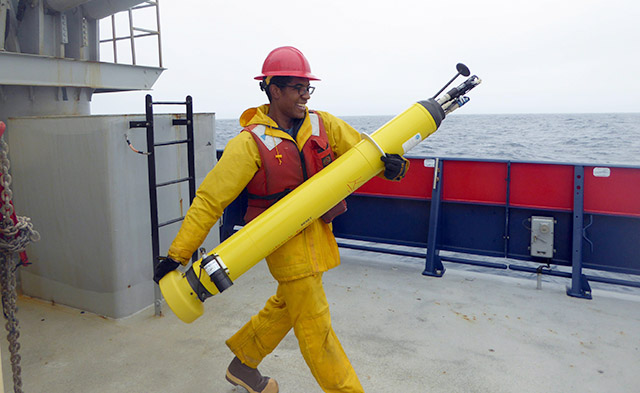 photo of researcher holding a float