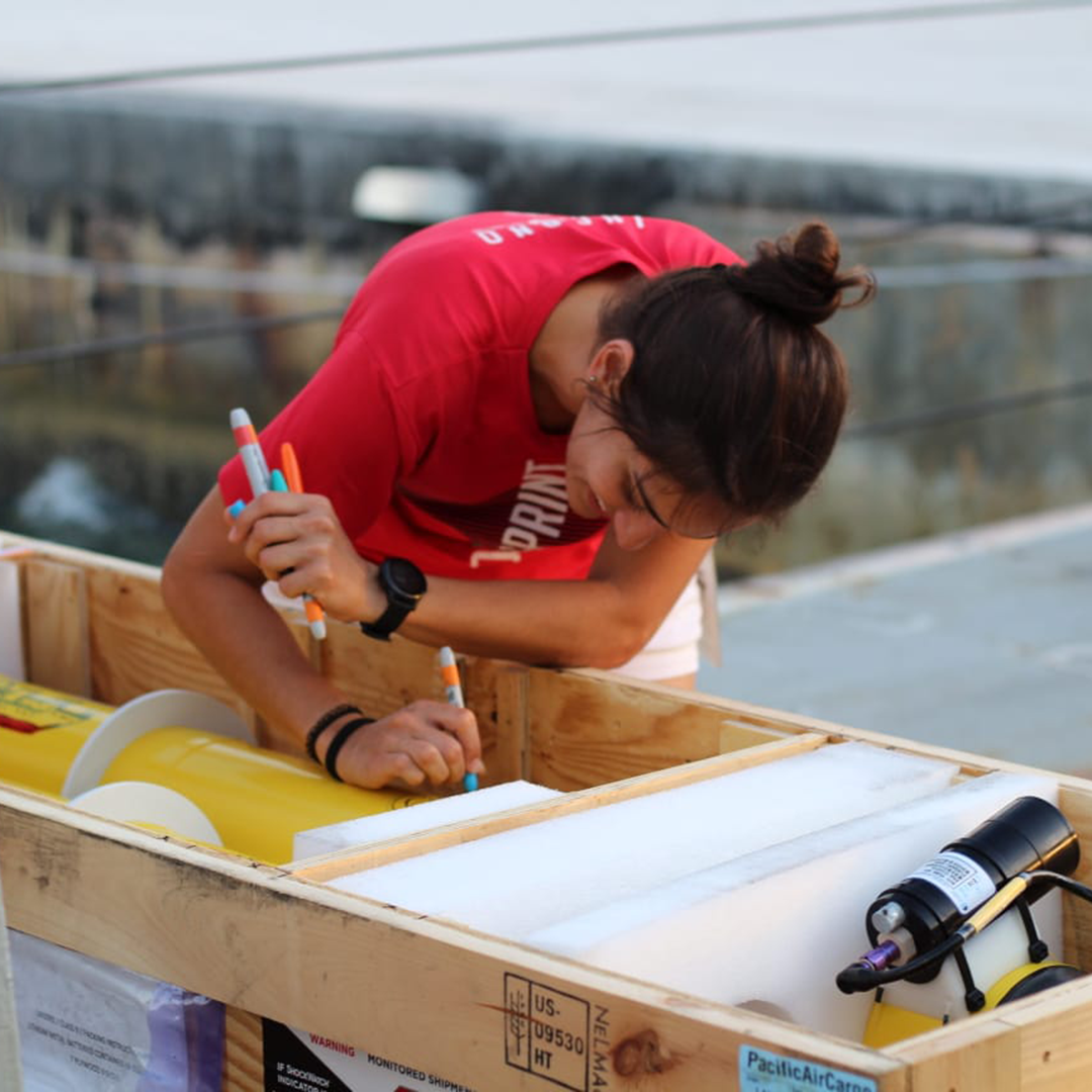 Mariana Aguirre decorating an Argo float. Photo by Vic Dina.