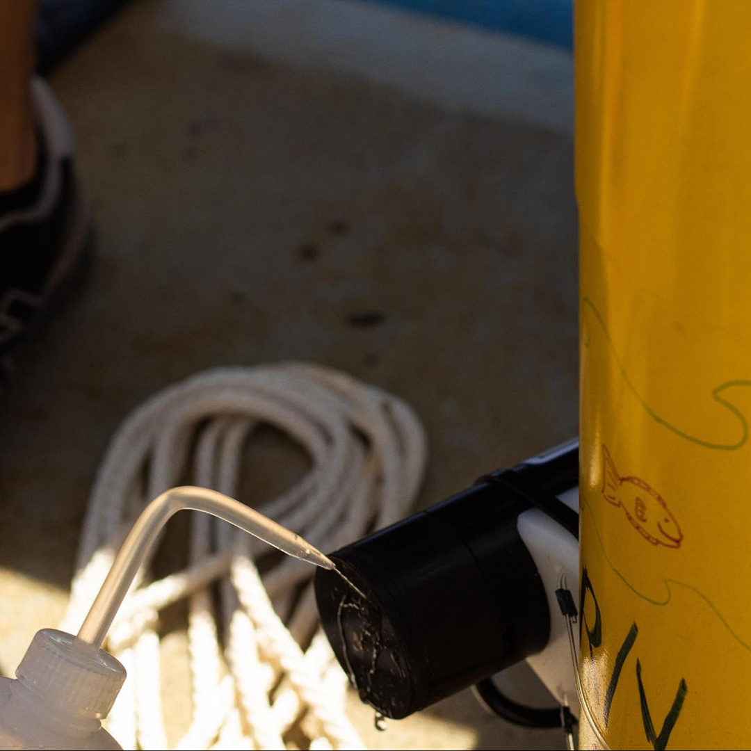 Cleaning the bio-optical sensor. Photo Credit: Vic Dana