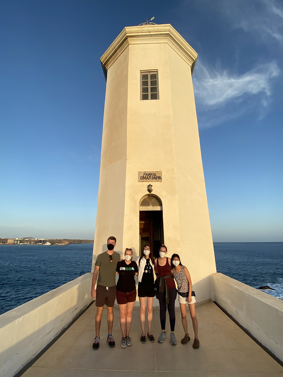 student members of the A13.5 science team, pose at the Praia lighthouse.