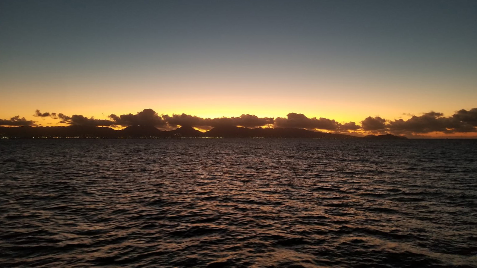 Sunrise over Honolulu as we approach our final destination. Photo by Sidney Wayne.