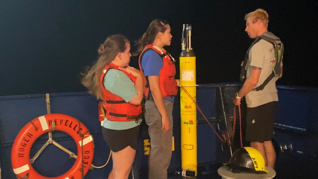 ResTech Mason Schettig and CTD watchstanders Alyssa Schultz and Turner Johnson deploying Mysterious Blue