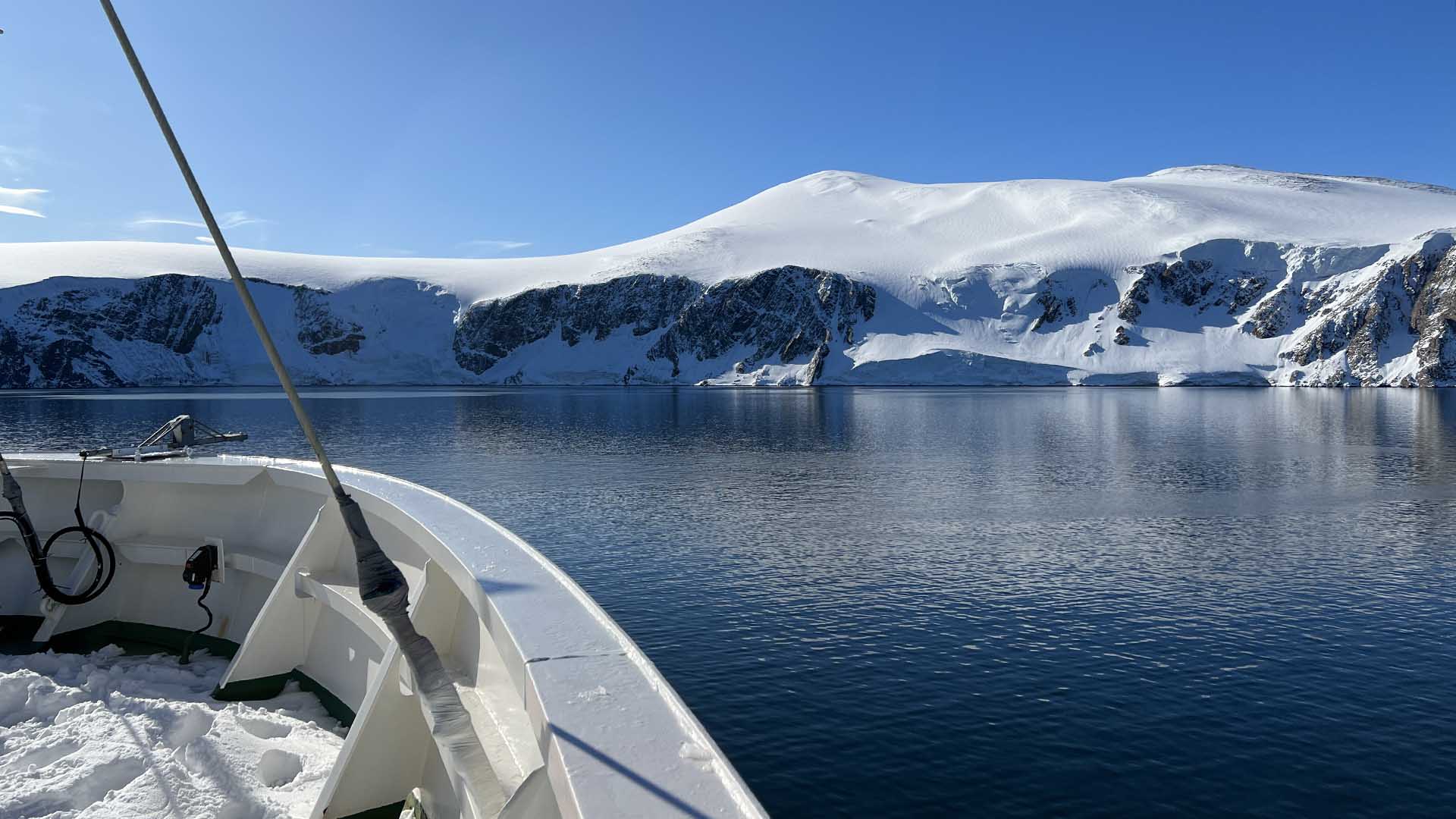 A photo showing the snow-covered bow of the IBRV Aaron