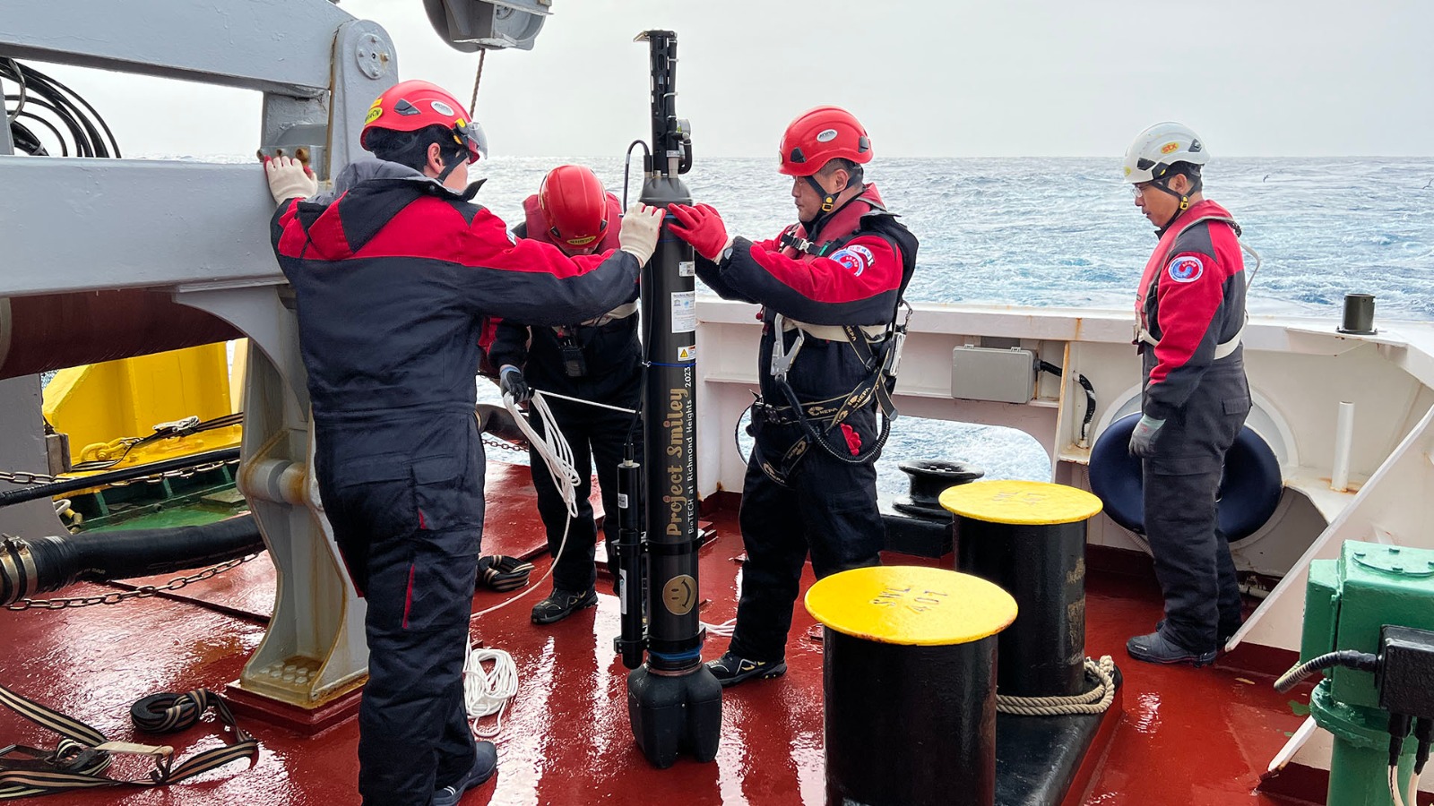 The crew of the IBRV Araon prepares to deploy Project Smiley float