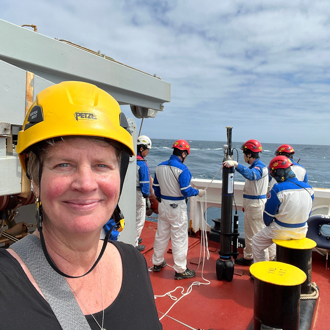 a selfie of Jenn while the crew deploys the first float over the side