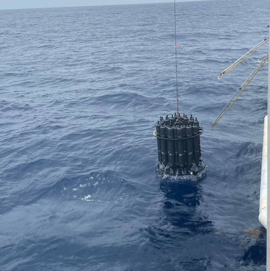 CTD frame coming out of the water to be recovered on the ship deck.