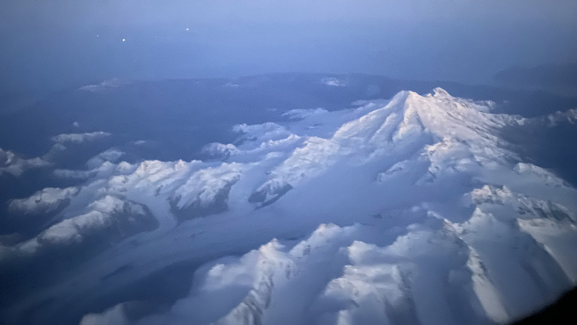 A glacier flowing from a volcano. Always get a window seat when flying in Alaska.