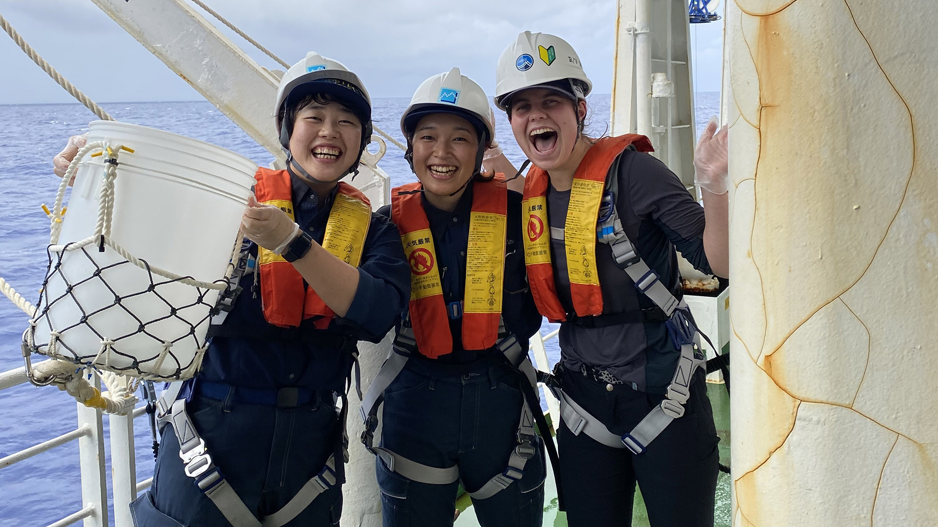 Bucket sampling for surface seawater. Mariko, Aya and I were the three graduate students of the 3am-3pm sampling team. It was so fun trading language and cultural insights with them and sharing early morning laughs! Photo: Akiko Makabe