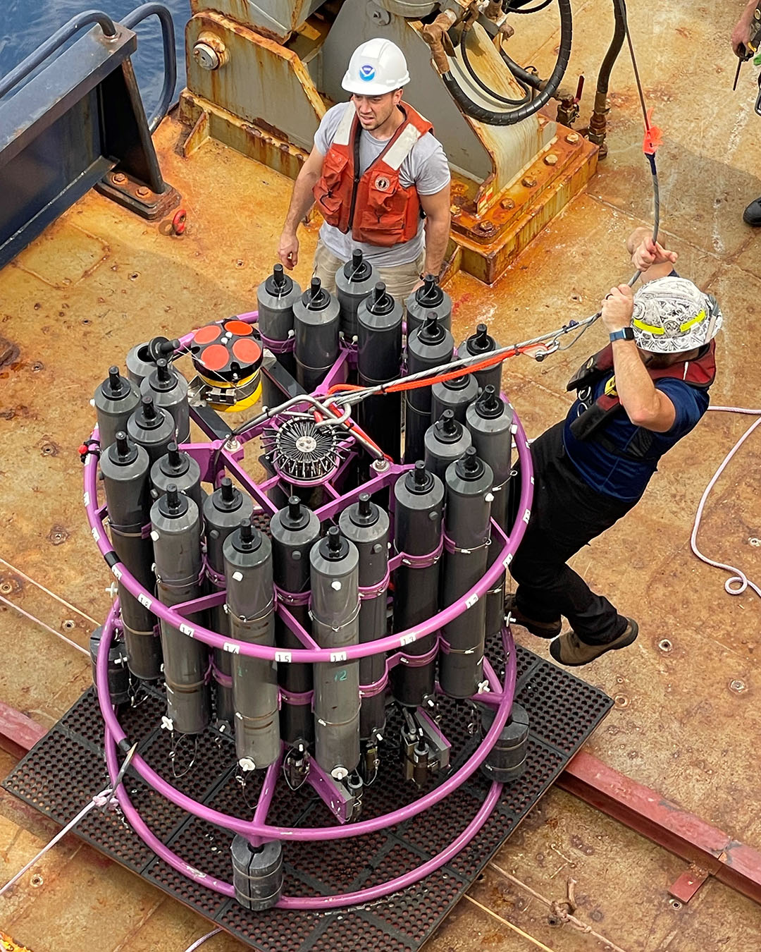 Jay Hooper and Christian Saiz, University of Miami Cooperative Institute for Marine and Atmospheric Sciences (CIMAS), prepare the CTD for deployment.