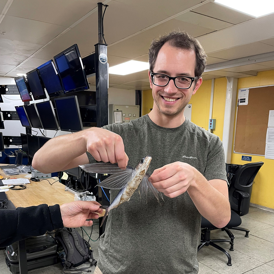 Chief Scientist Zachary Erickson, NOAA PMEL, and the flying fish that landed on deck!