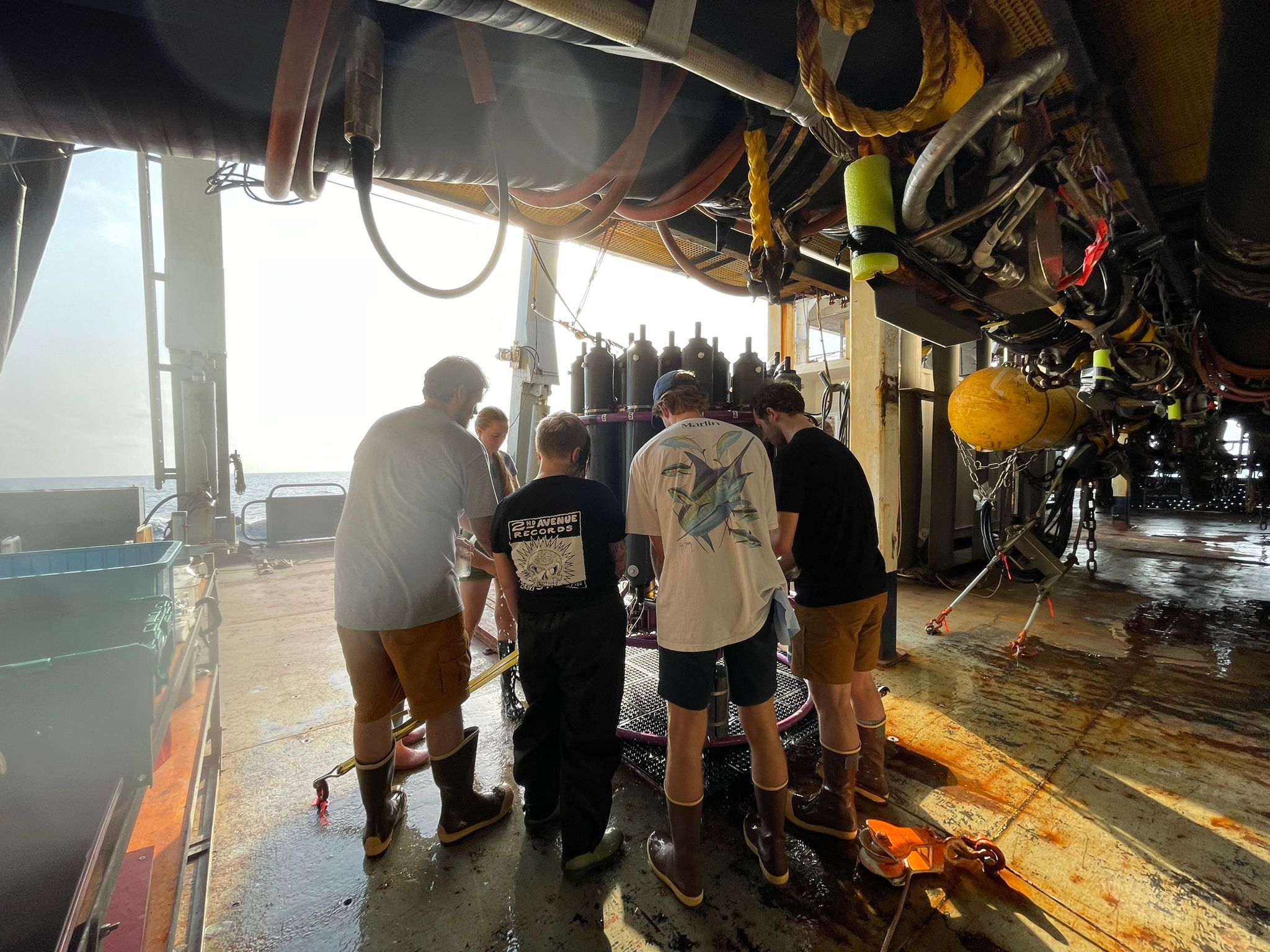 PIC 3 Team Team of oceanographers aboard R/V Marcus G. Langseth collecting water samples for various chemical analysis. Picture by Teresa Kennedy (UT Tyler; URI).