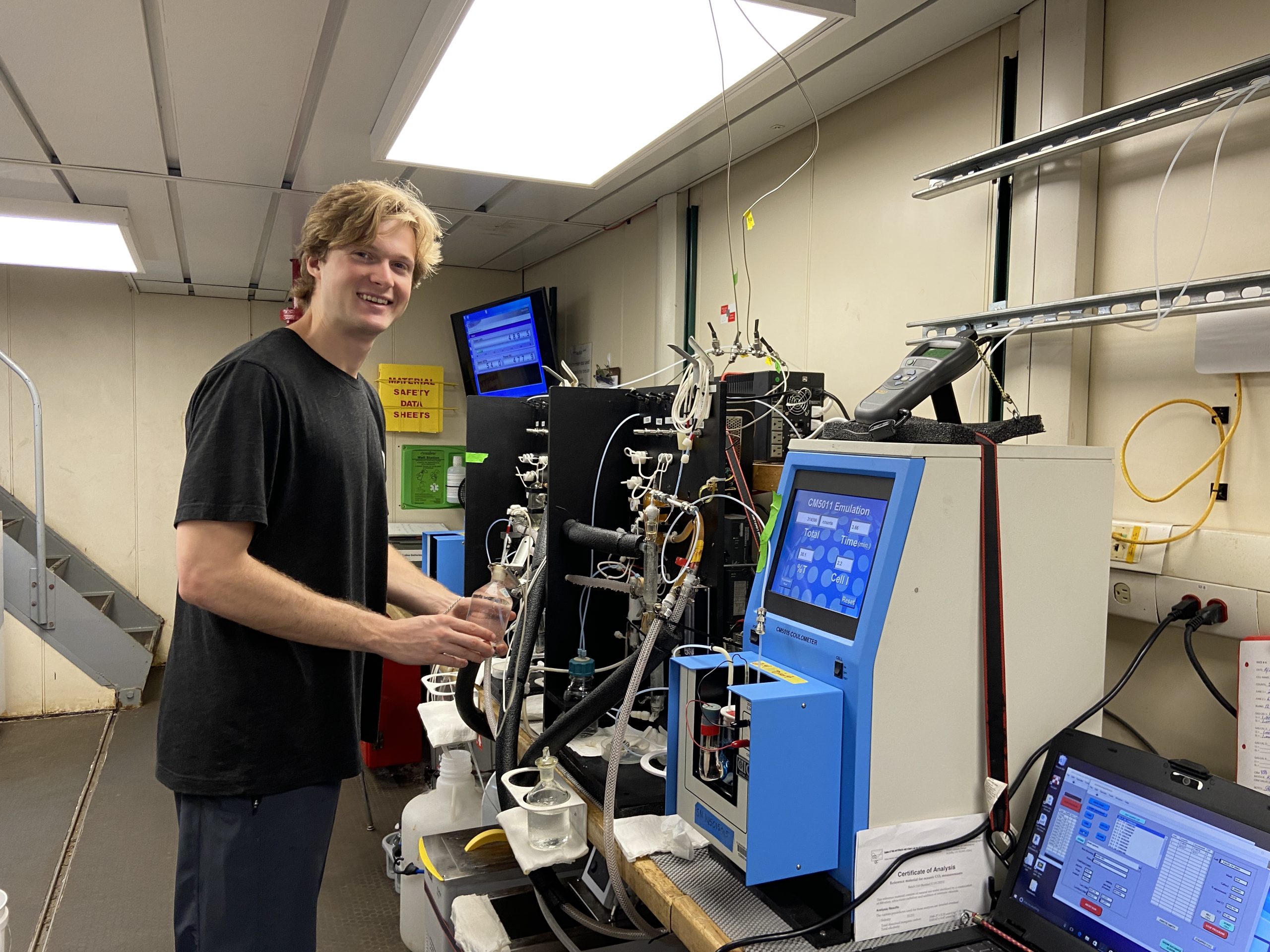 PIC 5 Evan Lab Evan in the lab preparing the next sample for analysis. Picture by Anna Bruno (UW CICOES).