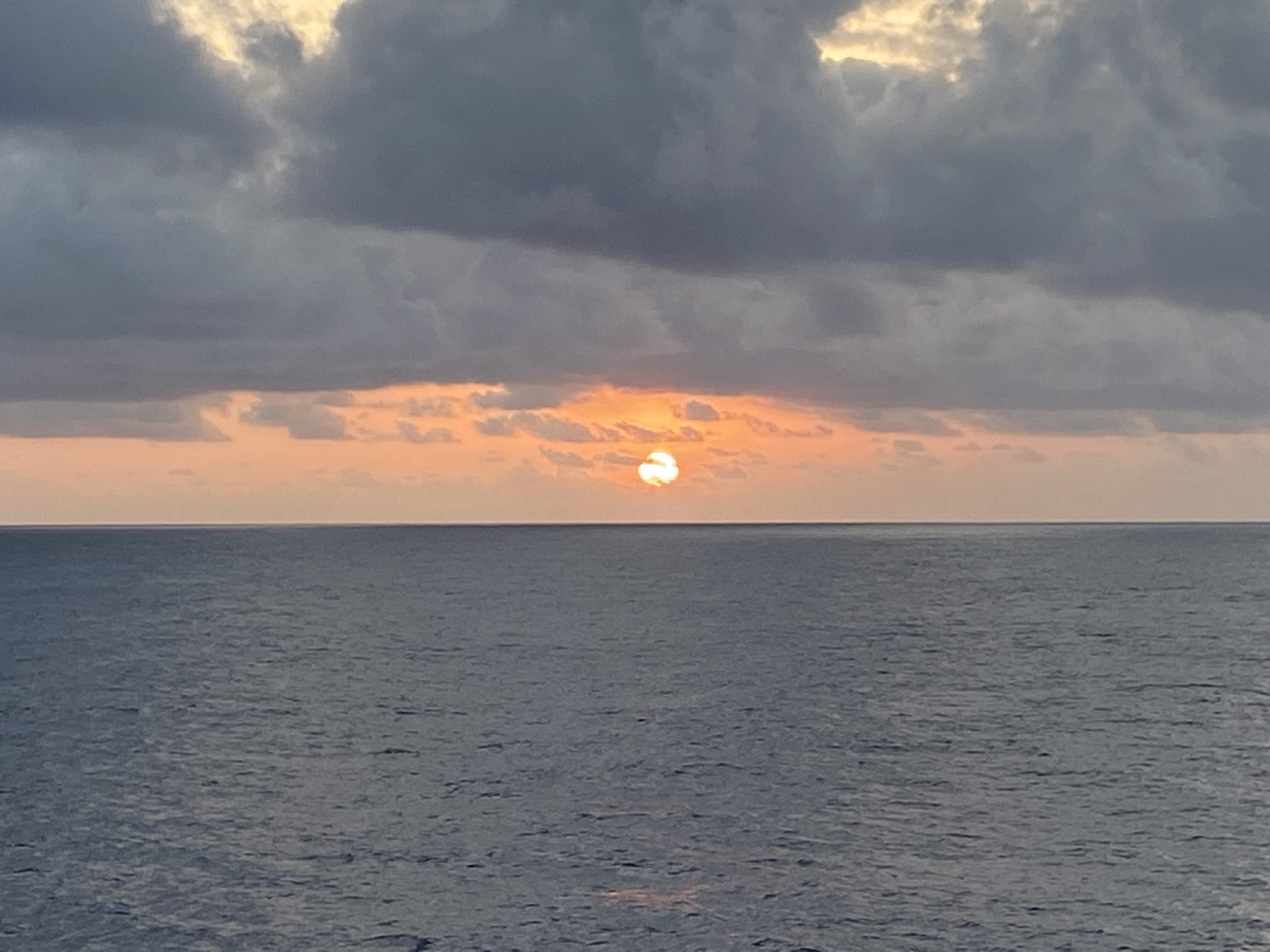 PIC 7 Sun Sun setting on the horizon in the open ocean west of Angola.