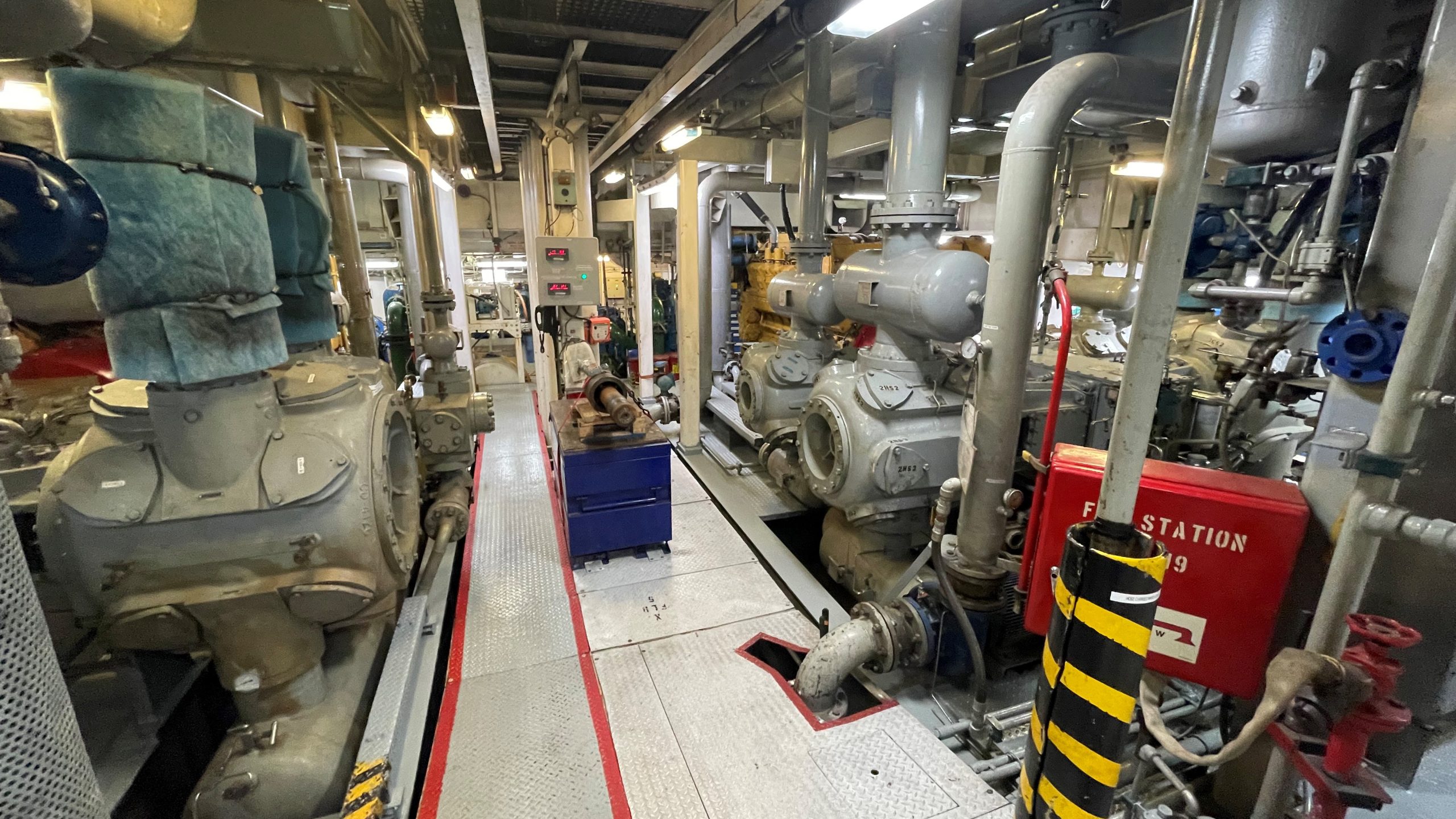 R/V Marcus G. Langseth engine room and Ariel compressors for the port side (on the left) and starboard side (on the right) of the ship. These air compressors are the largest in the world found on a research ship.]