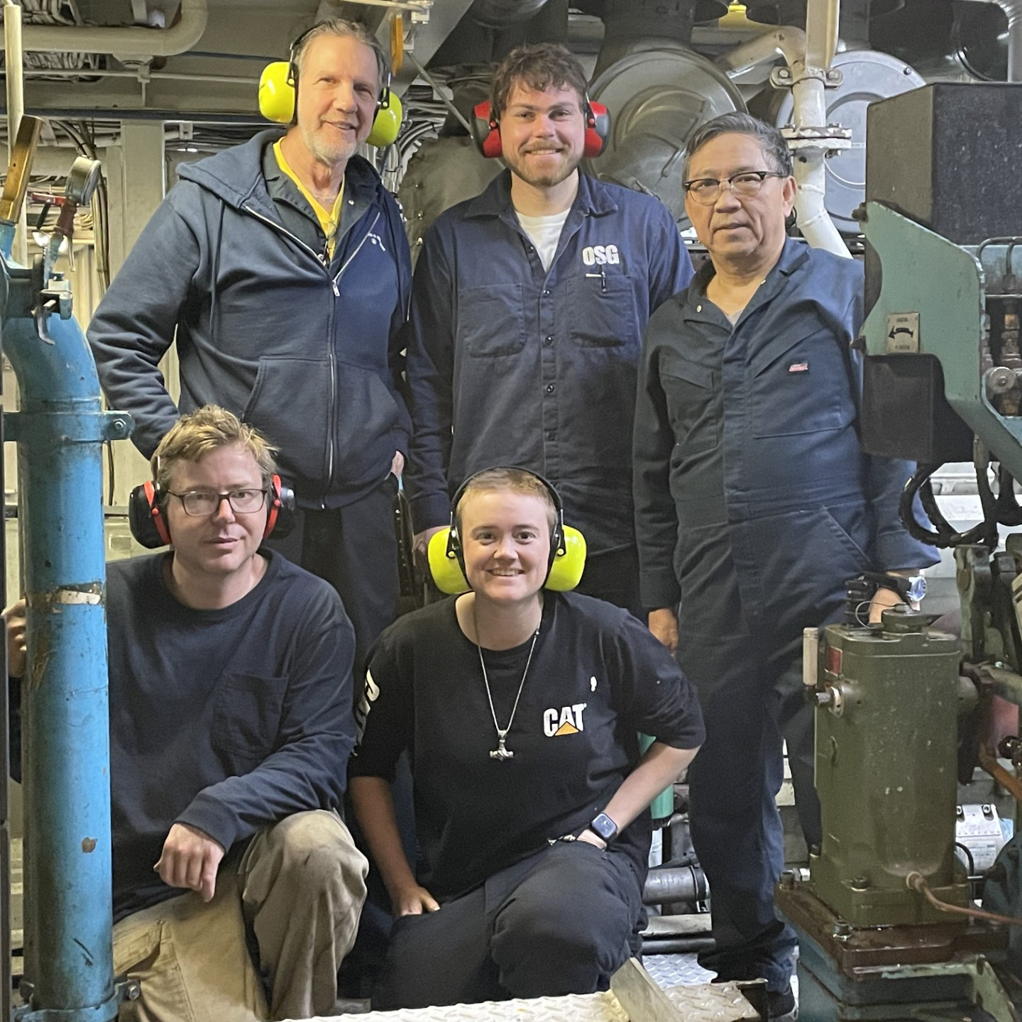 Some members of the Engine Room Team. Top row, from left to right: Mac Baker, Oiler; Mitchell Paul, Third Engineer (3A/E); and Rudy Florendo, Oiler. Bottom row, from left to right: Sean Sullivan, First Engineer (1A/E); and Sara Wright, Second Engineer (2A/E).
