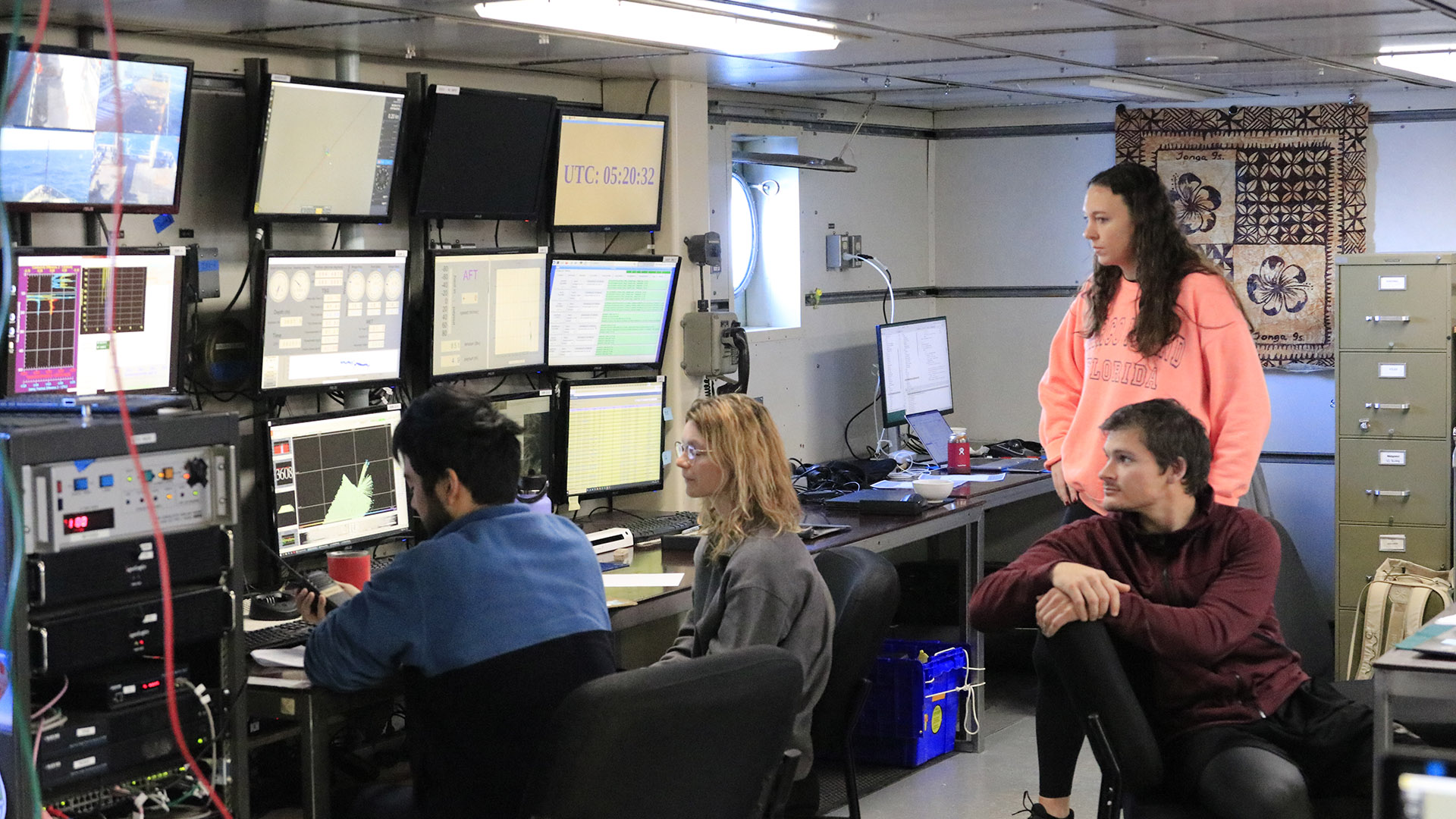 Ruth and Tatsu monitor the CTD as it progresses through the water column while Co-Chief Scientist Katelyn Schockman and Biologist Rob Bremer look on