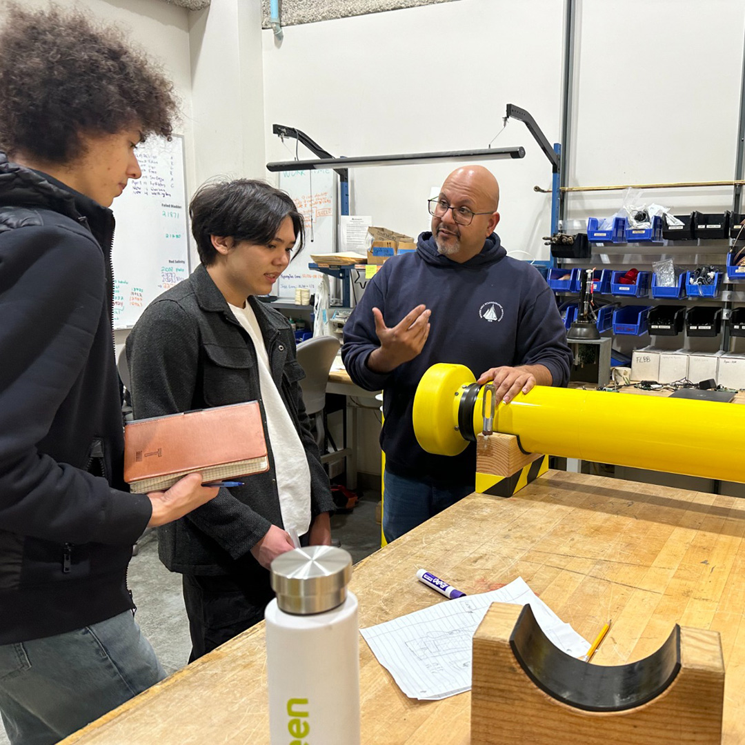 Rick Rupan gives students a tour of the float lab at UW. Photo by Joanna Rodriguez