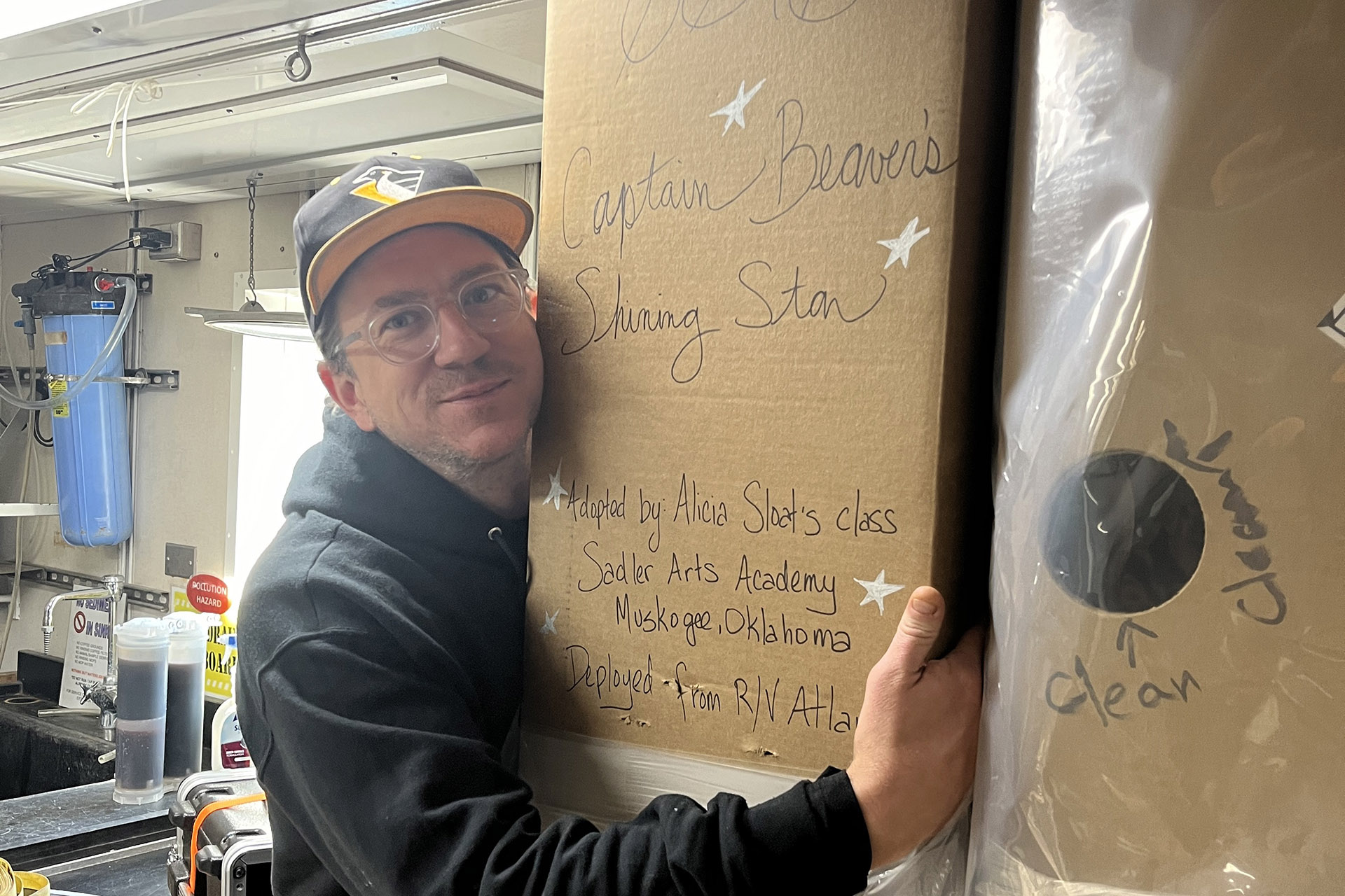 Captain Beavers Shining Star 3x2 Second mate Kenny Beaver with his namesake float, onboard R/V Atlantis.