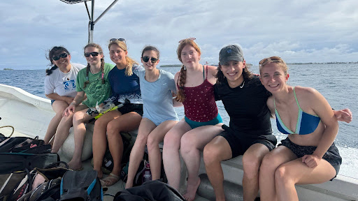 On a Boat On a boat headed to the coral reef dive site. Photo credit: Emma Rose Scott