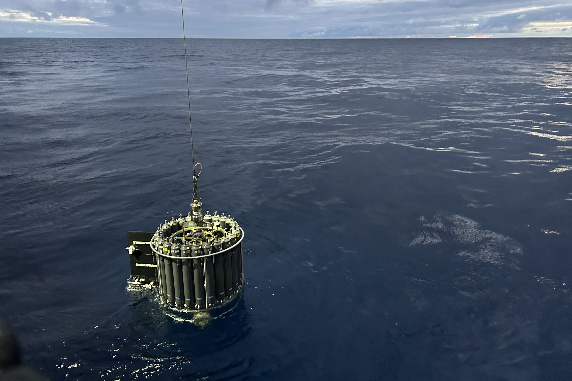 6.14 CTD Out 3x2 CTD rosette being pulled from the water after profiling down to 1000 meters and collecting water at certain depths on its way back up.