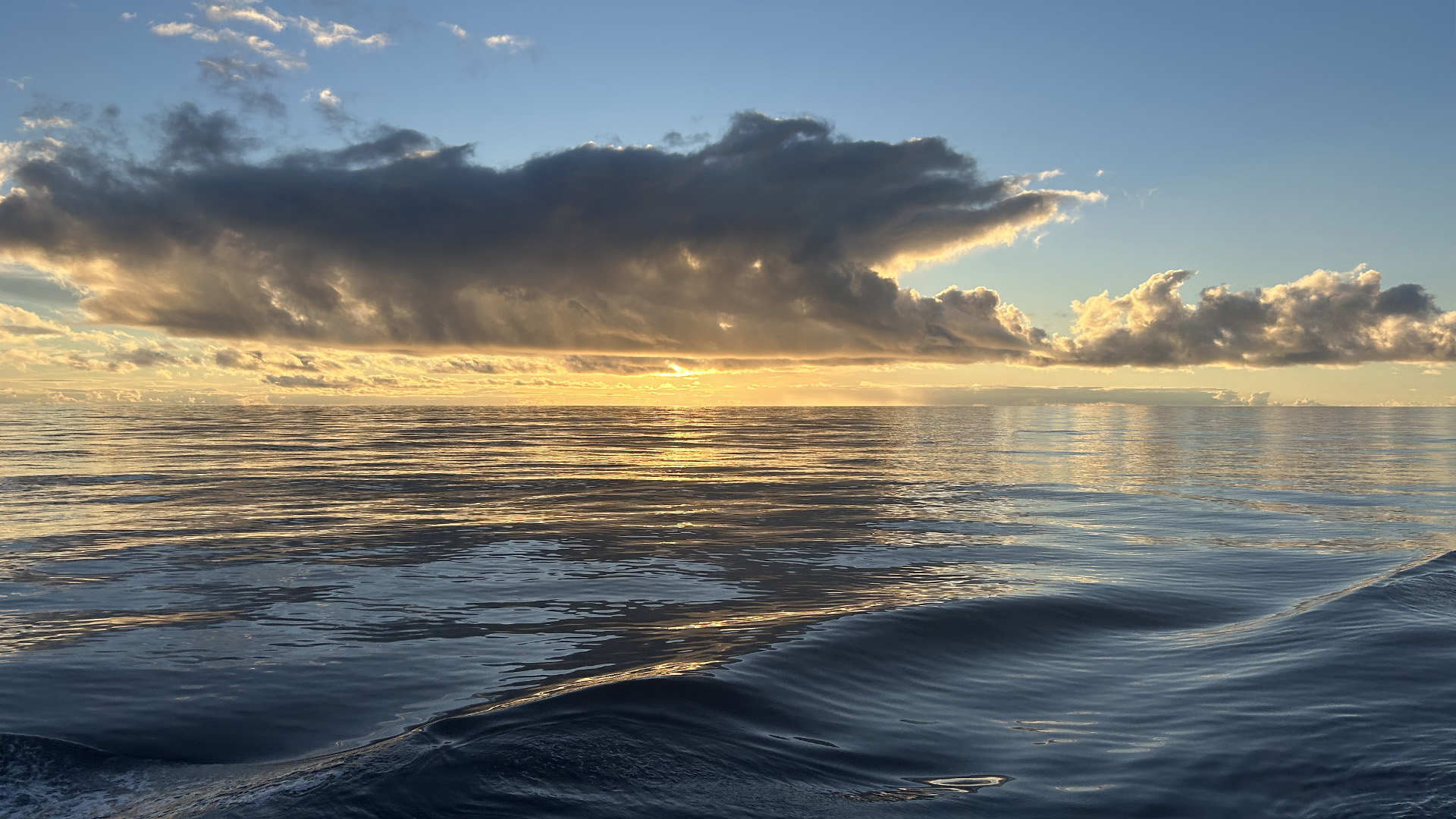 6.16 Sunset Glassy 16x9 Low winds as we steam south lead to practically flat seas, making sunsets like this one especially impressive