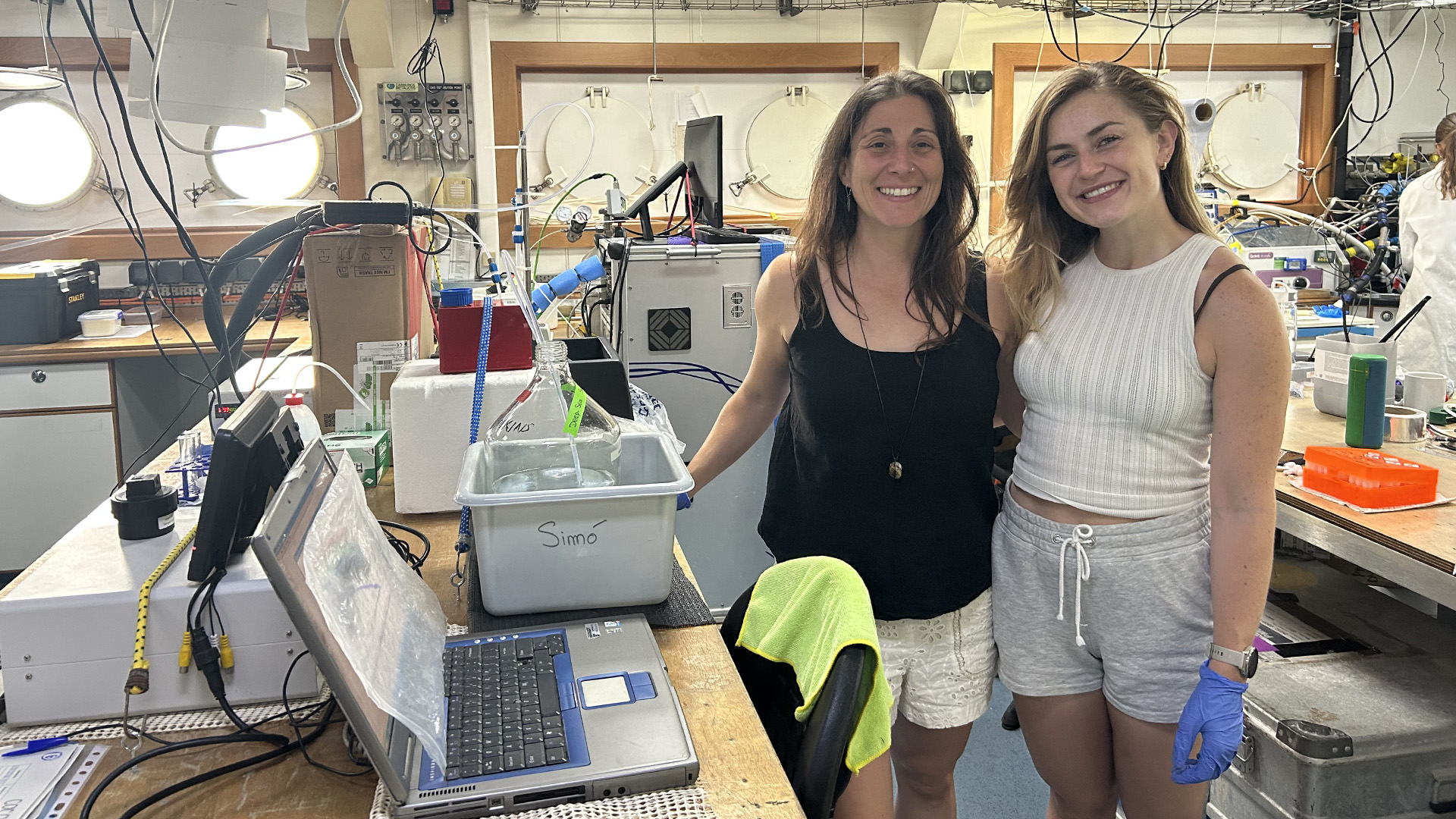 6.24 Incubators 16x9 Dr. Liz Deschaseaux (left) and doctoral student Lide Jansen Van Vuuren (right) in the Discovery deck lab after their final incubation sampling of the day.